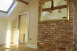 Example of the quality of finish showing brick chimney stack and real oak flooring.